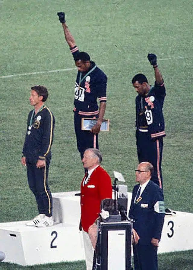 Tommie Smith and John Carlos raising their fists in the Black Power salute during the 1968 Mexico City Olympics.